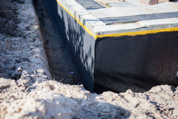 Professional Waterproofing technician working in Munford, AL